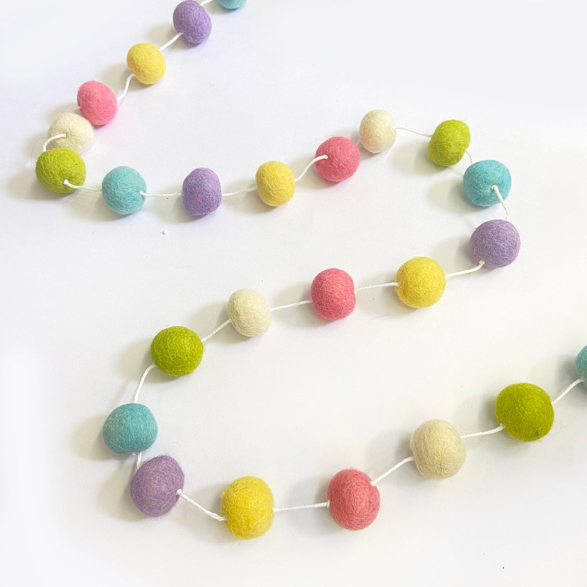 Pastel candy colour felt ball garland baby nursery room decor ideas ...